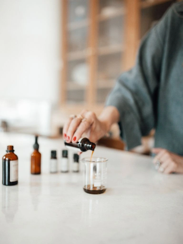 Skincare bottles on linen