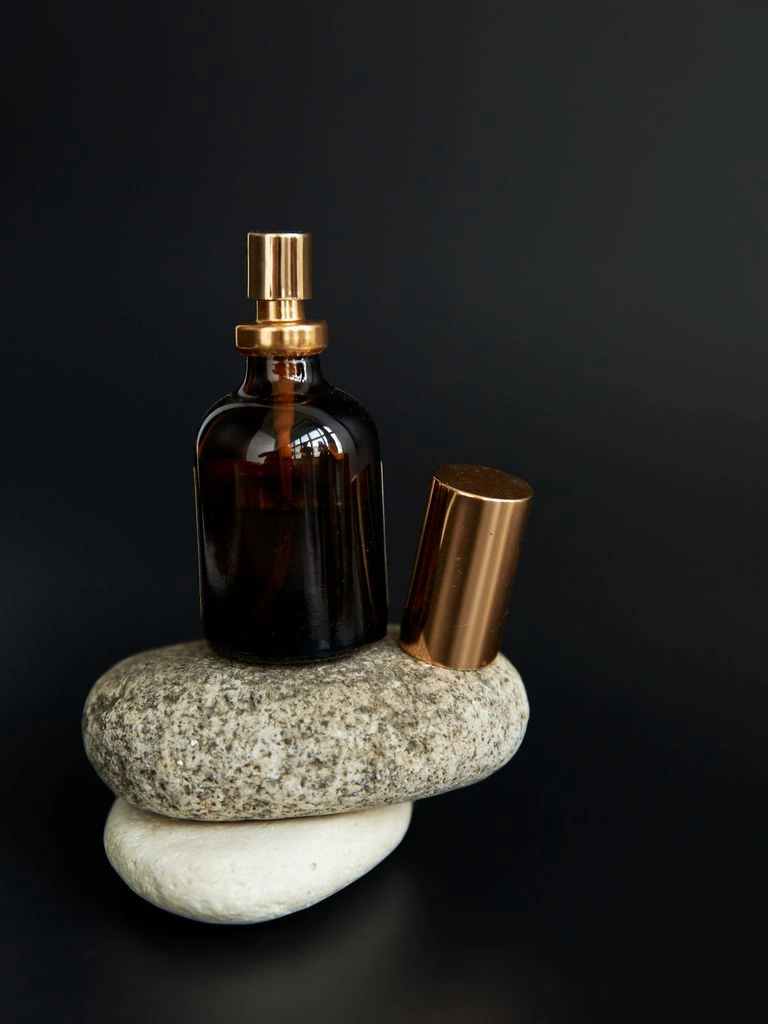 Beard oil bottle on slate